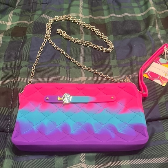 just beautiful Handbags - - NWT Waterproof, eco-friendly, wristlet/wallet.
silicone with chain